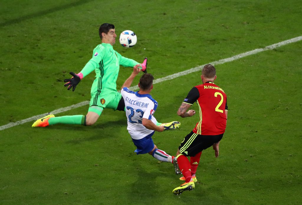 LYON, FRANCE - JUNE 13: Emanuele Giaccherini (C) of Italy scores his team's first goal past Thibaut Courtois of Belgium during the UEFA EURO 2016 Group E match between Belgium and Italy at Stade des Lumieres on June 13, 2016 in Lyon, France. (Photo by Clive Brunskill/Getty Images)