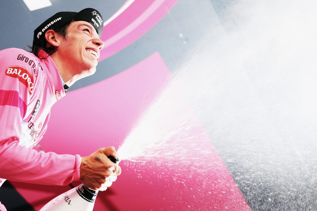 BAROLO, ITALY - MAY 22: Stage winner and new race leader and wearer of the Maglia Rosa Rigoberto Uran of Colombia and Omega Pharma-Quickstep celebrates and sprays prosecco on the podium after winning the twelfth stage of the 2014 Giro d'Italia, a 42km Individual Time Trial stage between Barbarasco and Barolo on May 22, 2014 in Barbarasco, Italy. (Photo by Bryn Lennon - Velo/Getty Images)