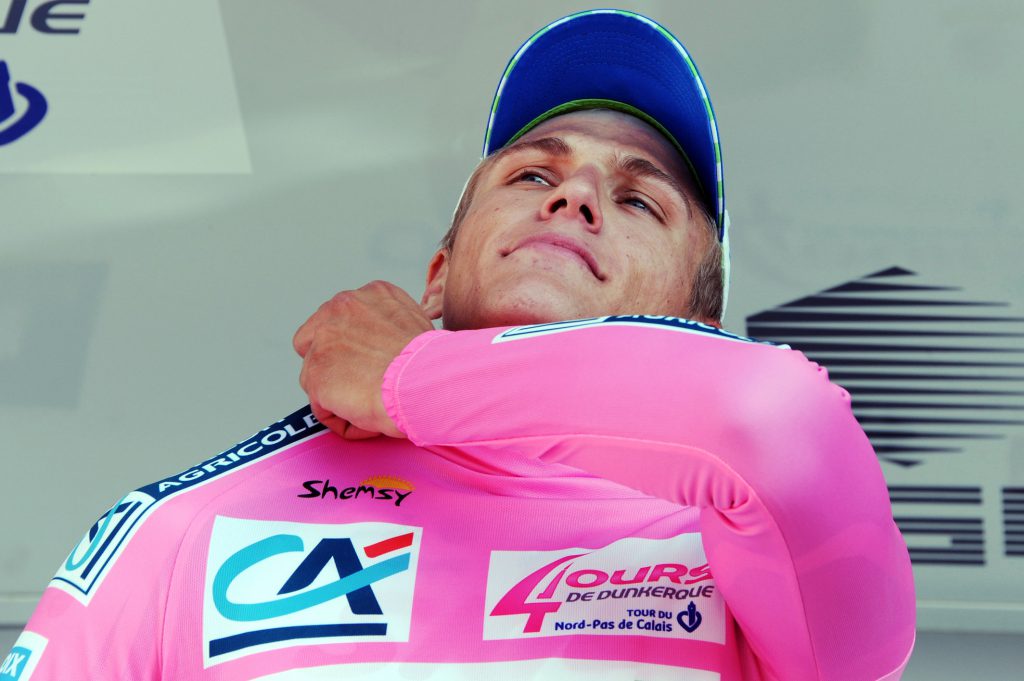 German cyclist Marcel Kittel puts on his pink jersey of overall leader on the podium after winning the first stage of the Four Days of Dunkerque cycling race on May 4, 2010 in Orchies, northern France. AFP PHOTO/ PASCAL PAVANI (Photo credit should read PASCAL PAVANI/AFP/Getty Images)