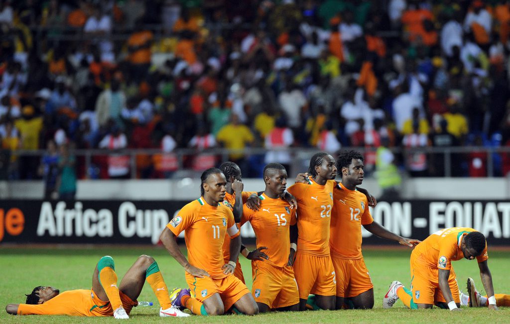 Ivory Coast national football team players react with disappointement after losing the African Cup of Nations final football match between Zambia and Ivory Coast on February 12, 2012, at the Stade de l'Amitie in Libreville. Zambia won the match during the final penalty shootout. AFP PHOTO / FRANCK FIFE (Photo credit should read FRANCK FIFE/AFP/Getty Images)