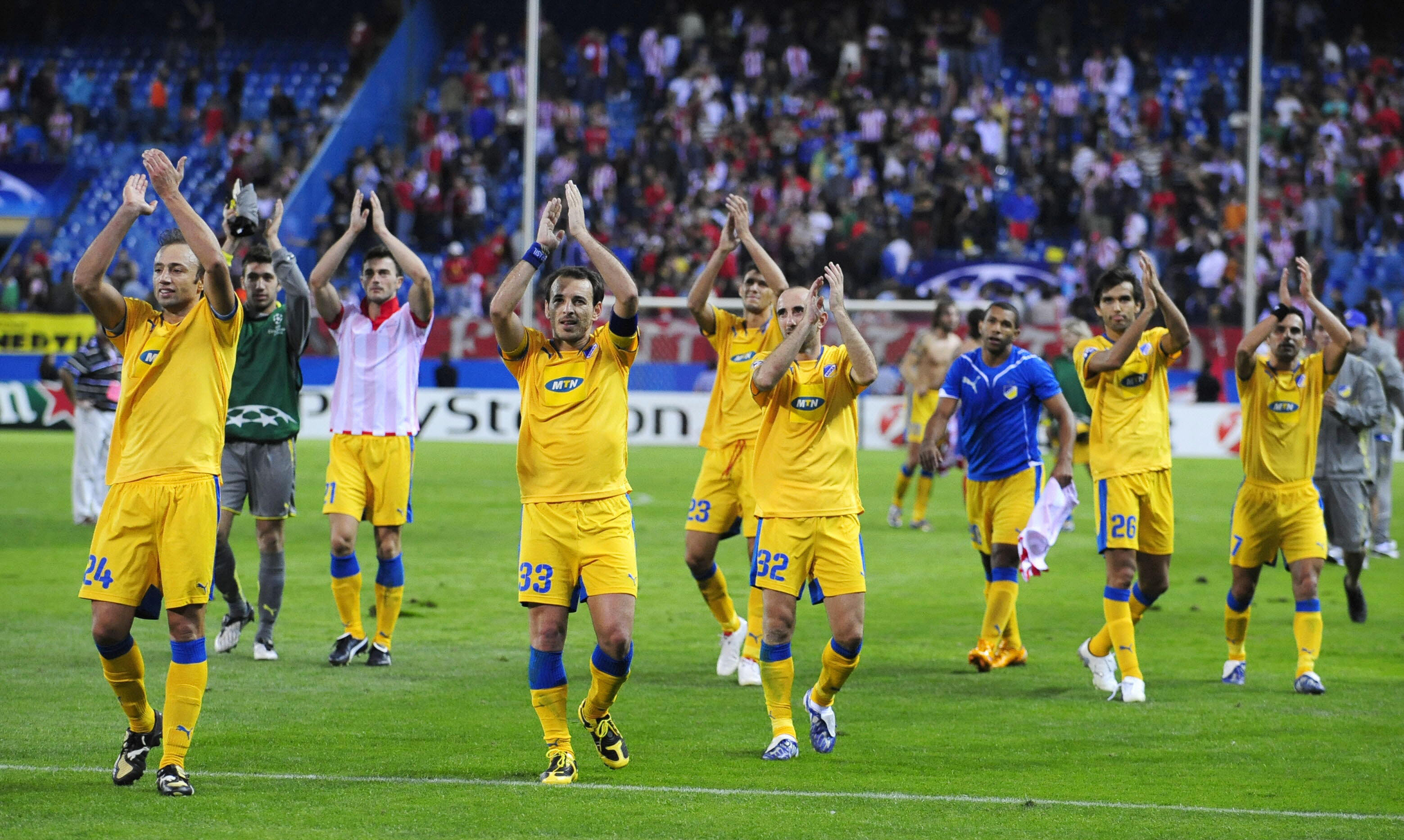 Apoel's players celebrate after their UEFA Champions league football match against Atletico Madrid at the Vicente Calderon stadium on September 15, 2009 in Madrid. The match ended in a 0-0 draw. AFP PHOTO/DOMINIQUE FAGET (Photo credit should read DOMINIQUE FAGET/AFP/Getty Images)