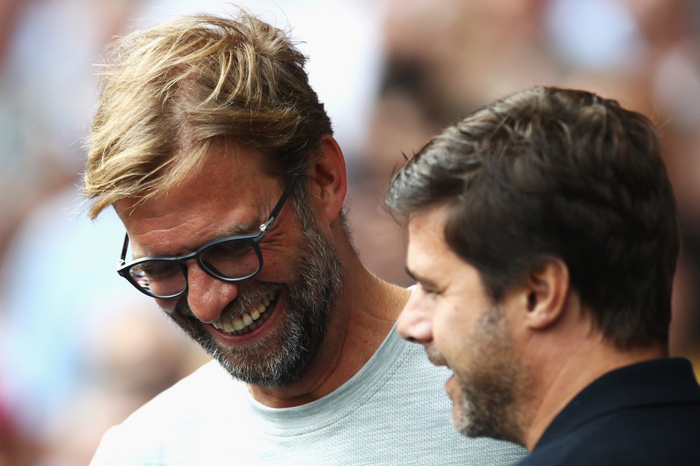 LONDON, ENGLAND - AUGUST 27: Jurgen Klopp, Manager of Liverpool (L) shares a smile with Mauricio Pochettino, Manager of Tottenham Hotspur (R) during the Premier League match between Tottenham Hotspur and Liverpool at White Hart Lane on August 27, 2016 in London, England. (Photo by Julian Finney/Getty Images)