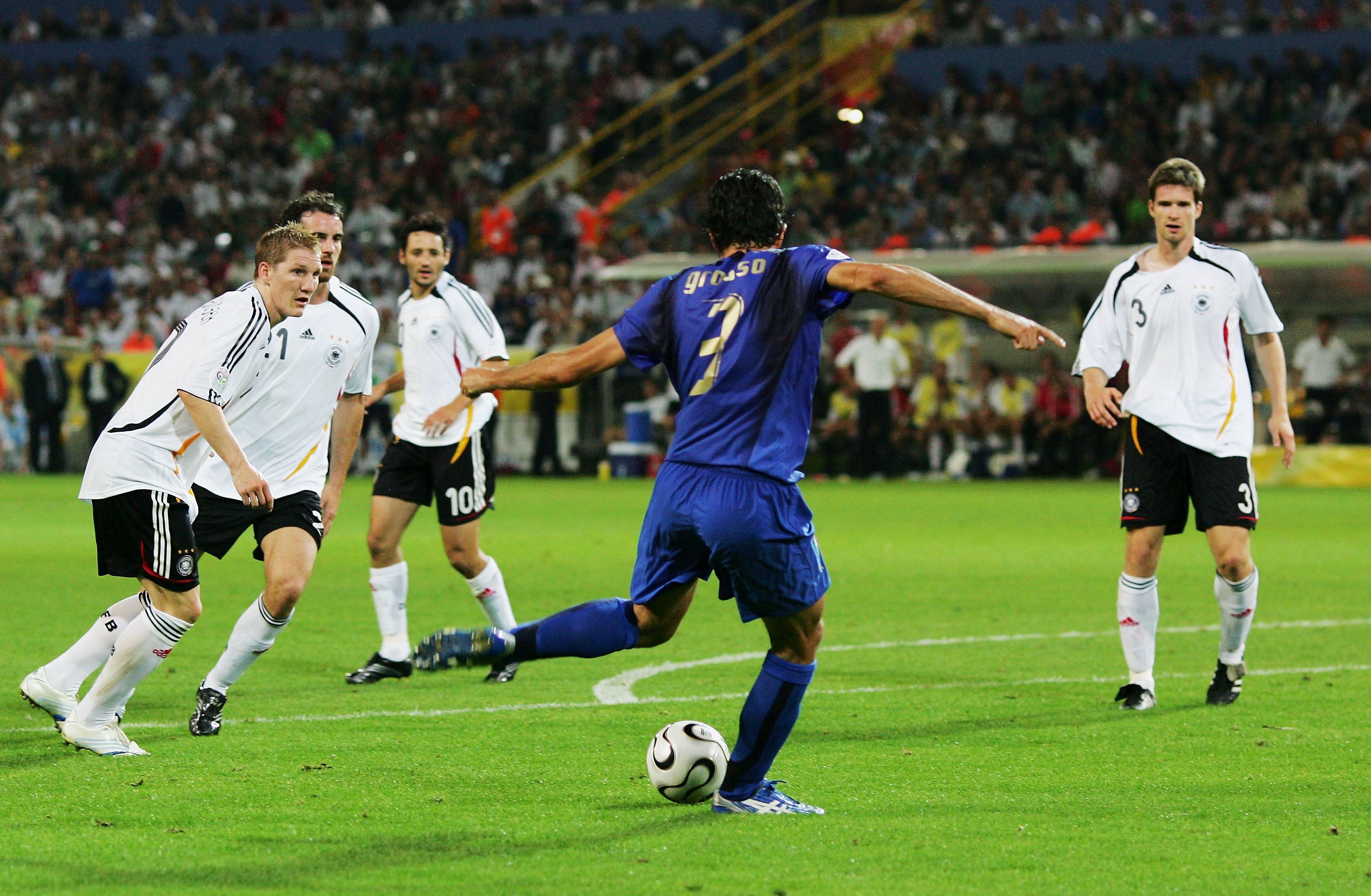 DORTMUND, GERMANY - JULY 04: Fabio Grosso of Italy scores his team's first goal in extra time during the FIFA World Cup Germany 2006 Semi-final match between Germany and Italy played at the Stadium Dortmund on July 04, 2006 in Dortmund, Germany. (Photo by Alex Livesey/Getty Images)