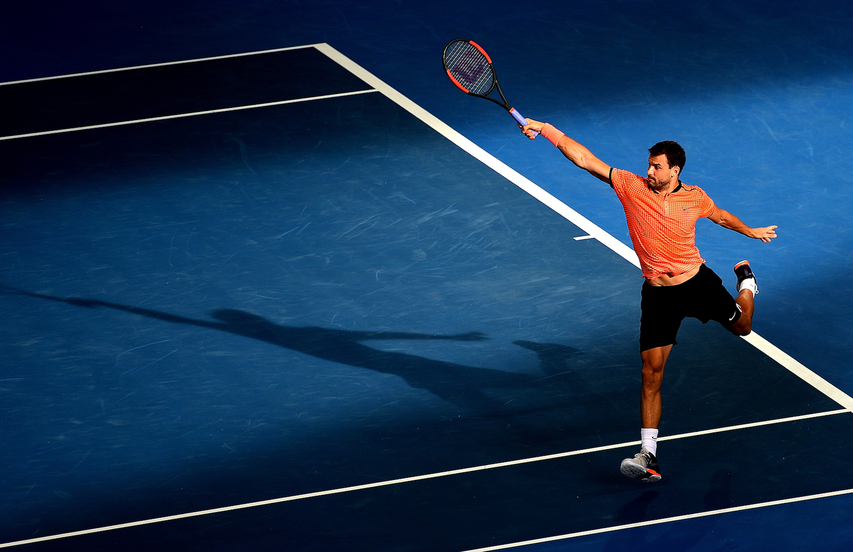 BRISBANE, AUSTRALIA - JANUARY 06: Grigor Dimitrov of Bulgaria plays a backhand against Dominic Thiem of Austria on day six of the 2017 Brisbane International at Pat Rafter Arena on January 6, 2017 in Brisbane, Australia. (Photo by Bradley Kanaris/Getty Images)