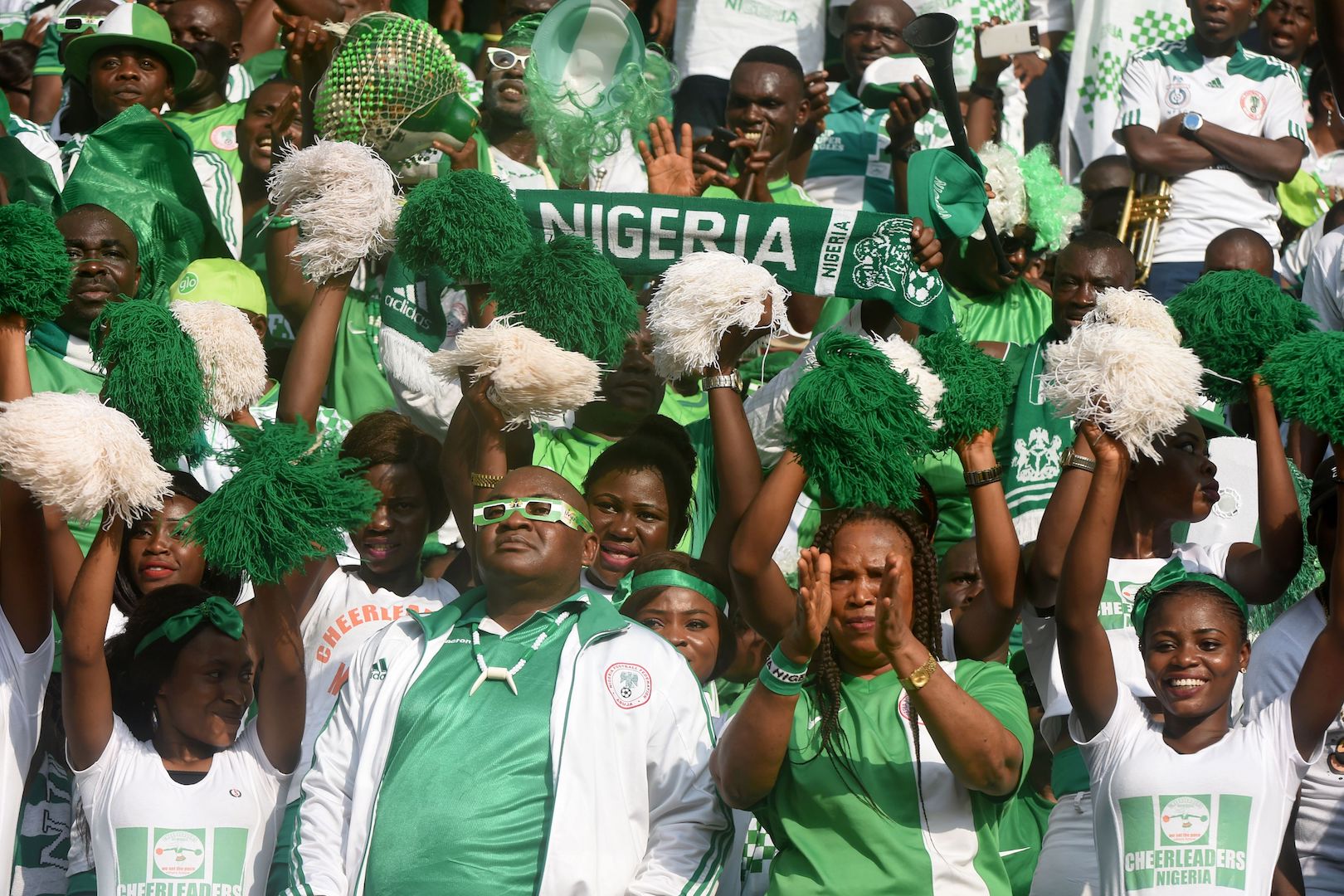 Nigerian fans cheer for their team during the 2018 FIFA World Cup African zone group B qualifying football match between Nigeria and Algeria at the Akwa Ibom State Stadium in Uyo on November 12, 2016. / AFP / PIUS UTOMI EKPEI (Photo credit should read PIUS UTOMI EKPEI/AFP/Getty Images)