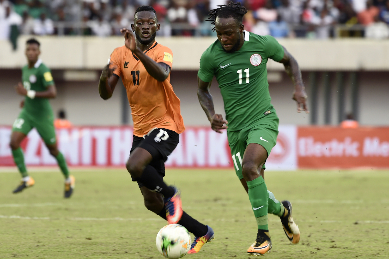 Nigerian attacker Victor Moses (R) tries to run past Zambia Chisamba Lungu during the FIFA World Cup 2018 qualifying football match between Nigeria and Zambia in Uyo, Akwa Ibom State, on October 7, 2017. / AFP PHOTO / PIUS UTOMI EKPEI (Photo credit should read PIUS UTOMI EKPEI/AFP/Getty Images)