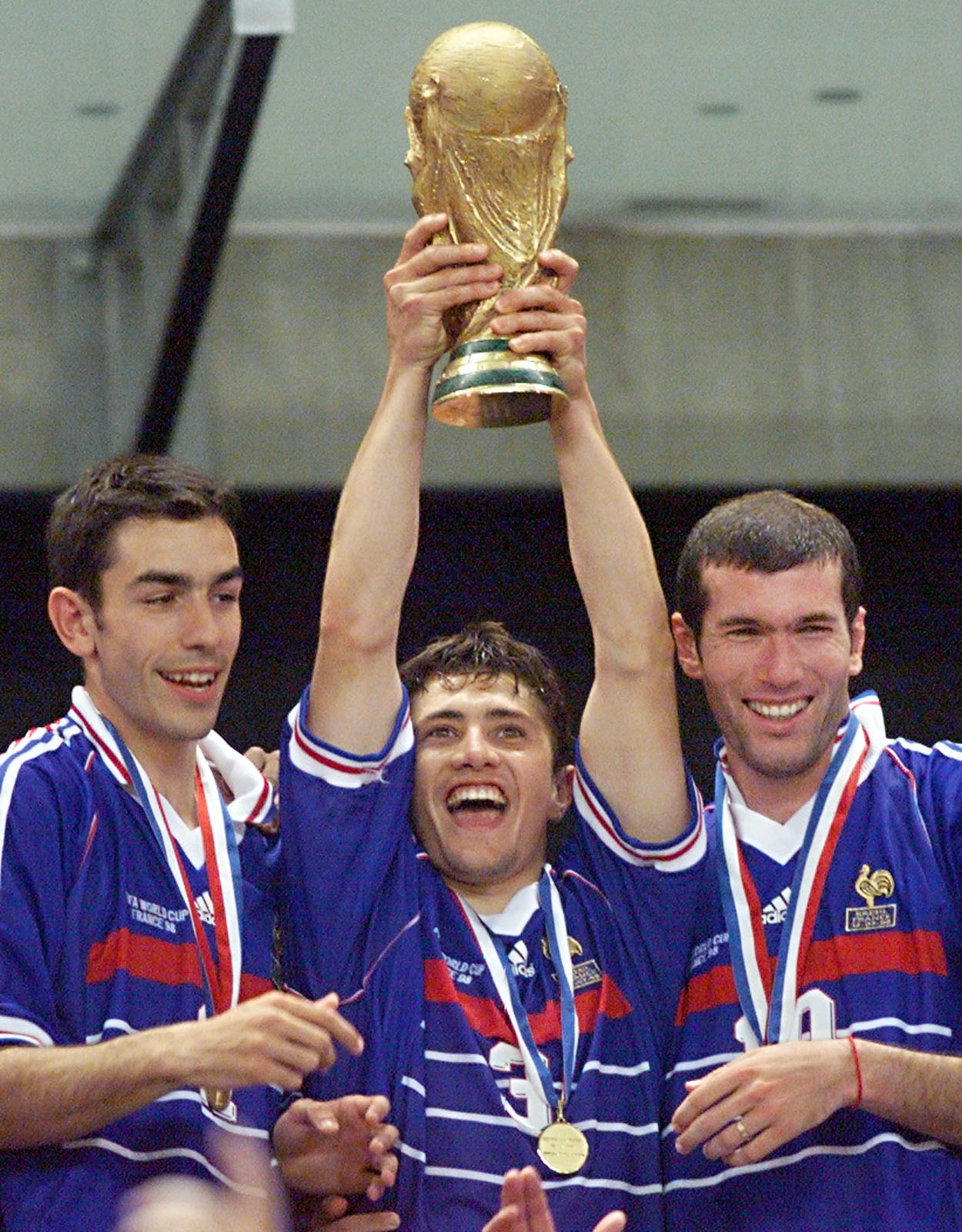 French forward Robert Pires is flanked by defender